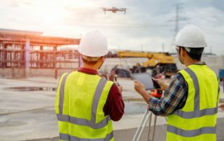 Workplace health and safety officers launching a drone on a work site | Featured image for Safety Innovations in the Workplace Blog by Bramwell Partners.