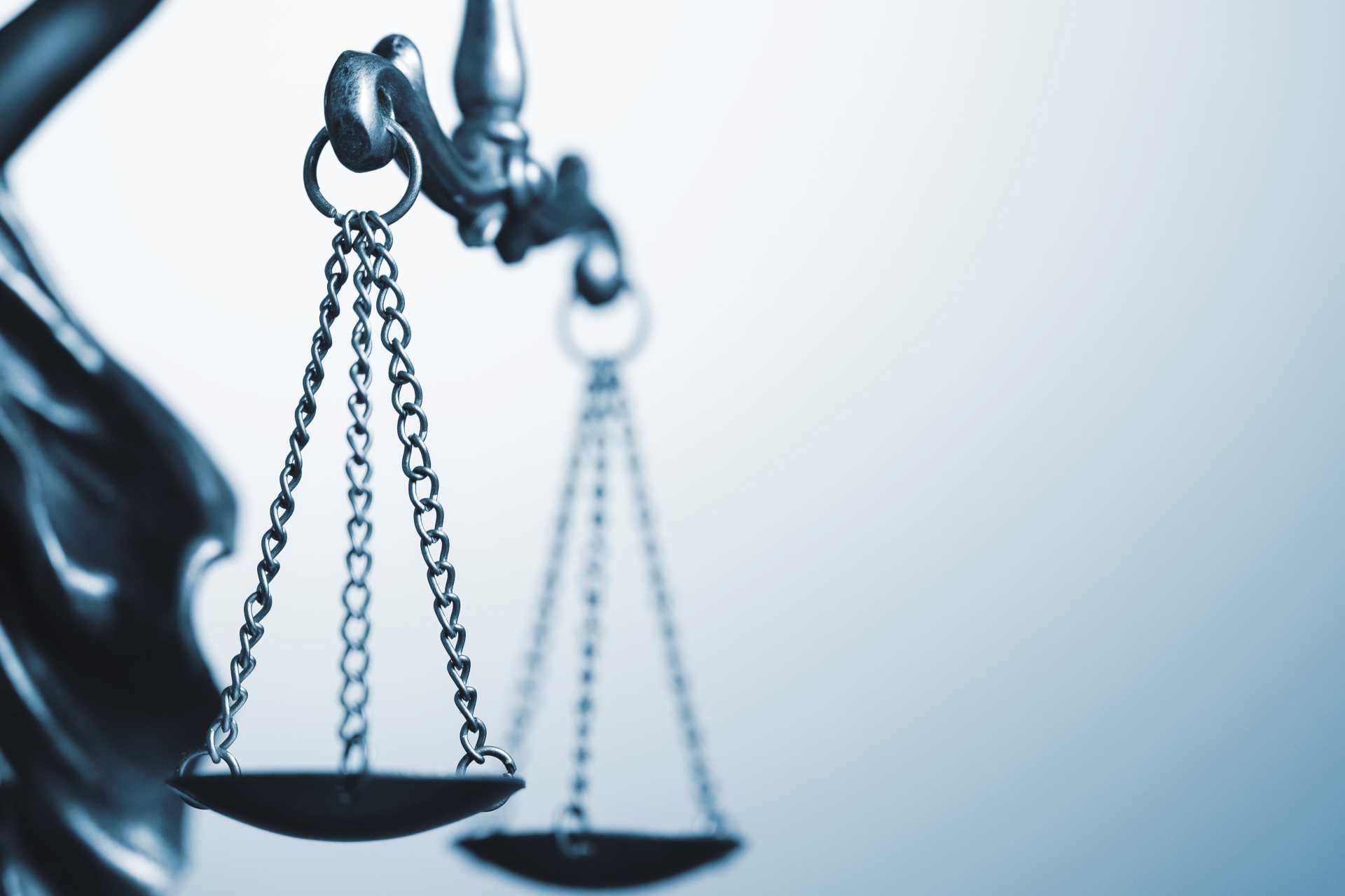 Close up photo of the scales of justice | Featured Image for the General Protections Claim Blog by Bramwell Partners.